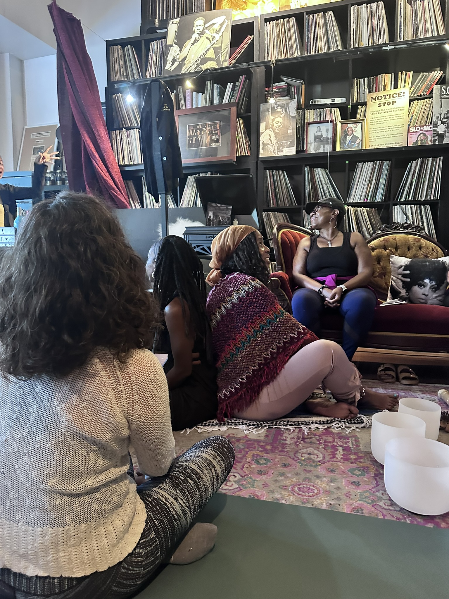 Guests gathered around singing bowls at Madame C.J. Walker Boutique Museum
